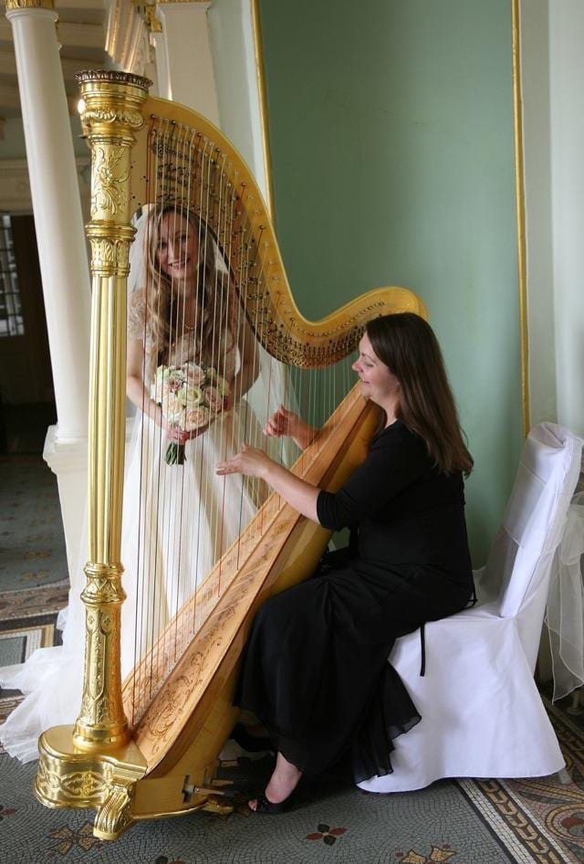 playing wedding harp