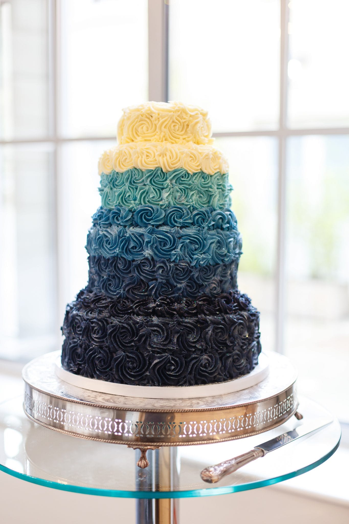 four tiered, blue butter cream iced wedding cake at Botleys Mansion