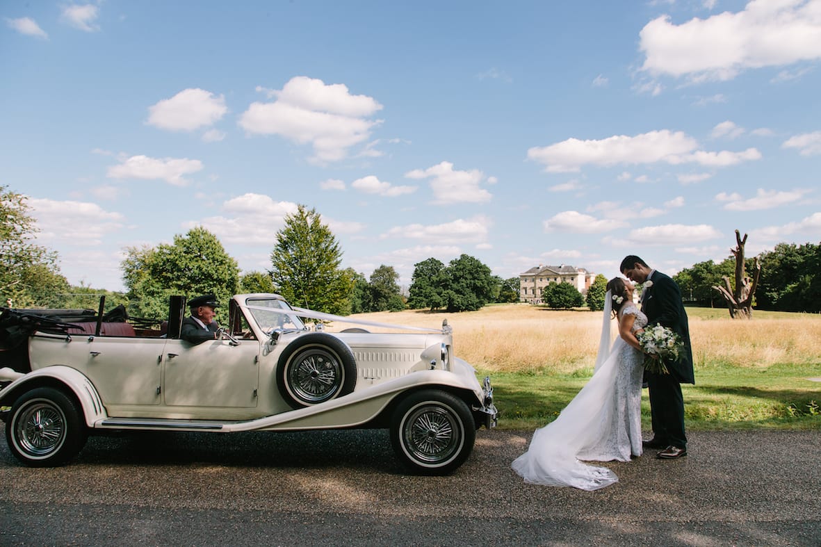 Mansion wedding venue Surrey bridal car newlyweds
