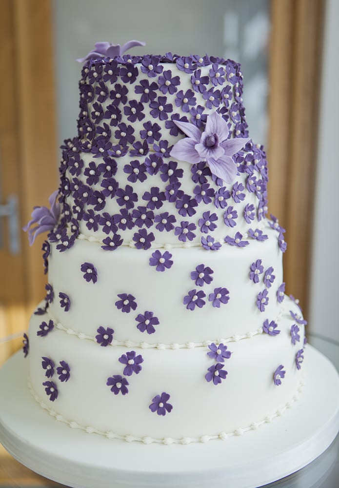 Purple floral wedding cake at Botleys Mansion Wedding