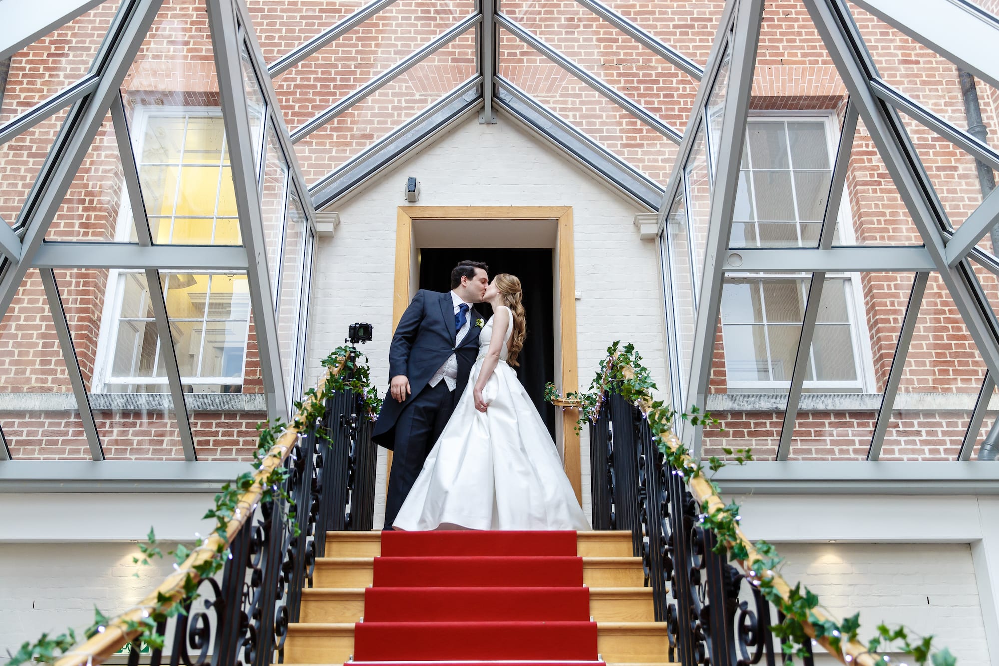 Botleys Mansion red carpet staircase couple kiss