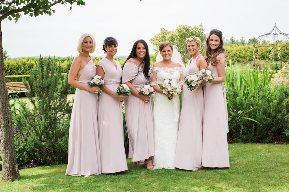 Bridesmaids pastel pink dresses and roses