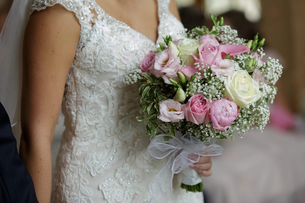 pink rose bridal bouquet and bridal dress details