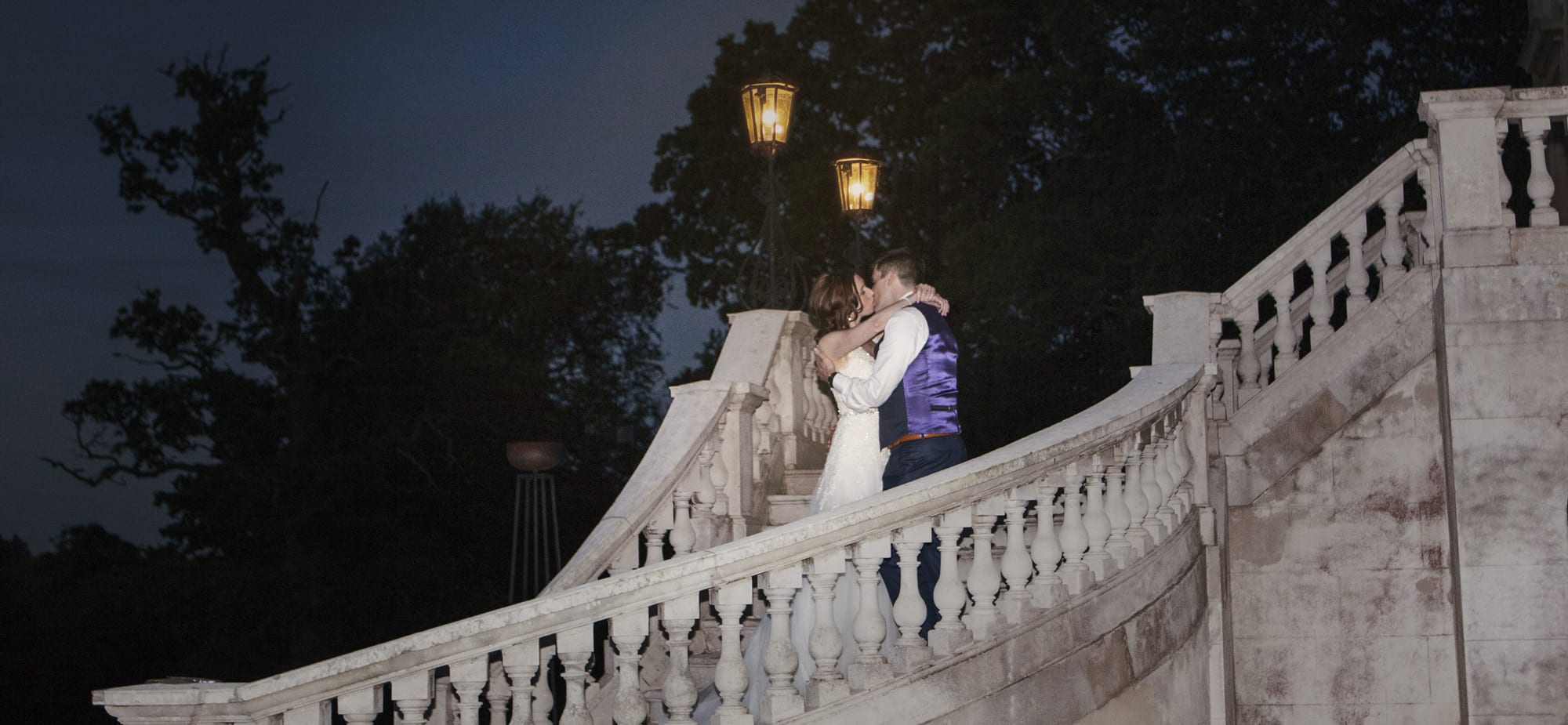 Botleys Mansion evening staircase kiss