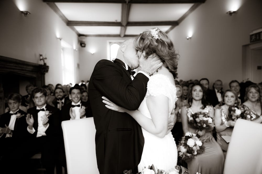 Bride Groom first kiss Abbots Hall black and white photo