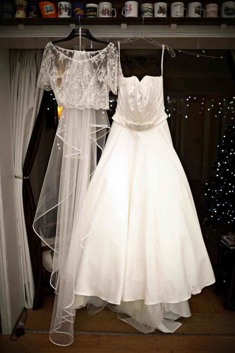 white a line wedding dress with beaded top and cathedral veil