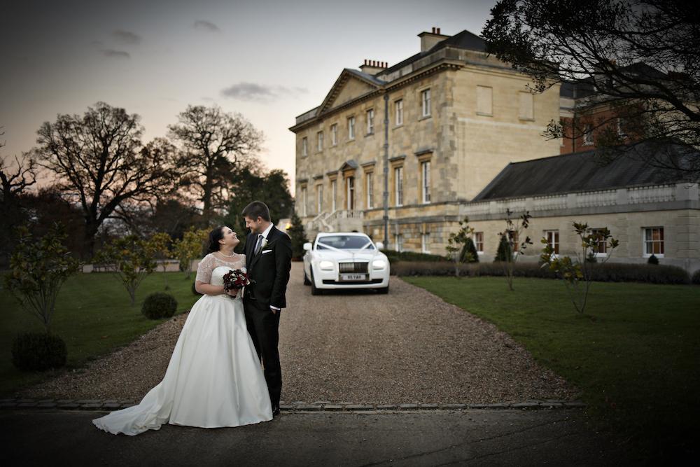 Botleys Mansion exterior couple photo with wedding car