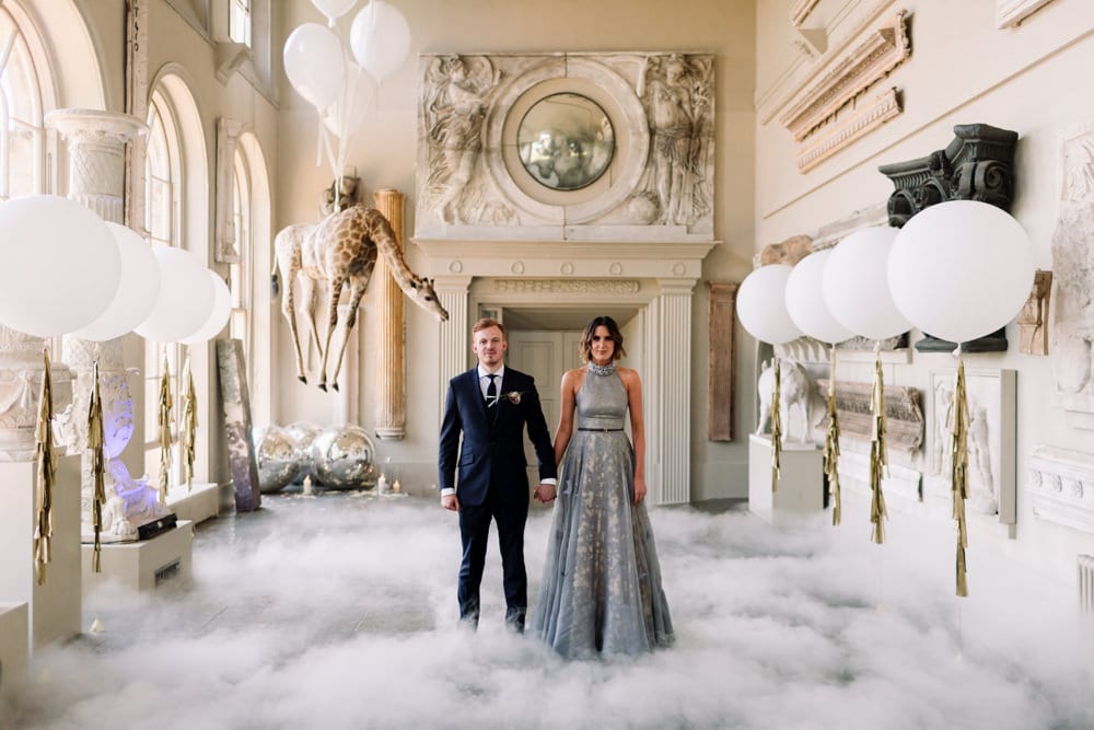 glam bride and groom with bubblegum balloons and smoke machine