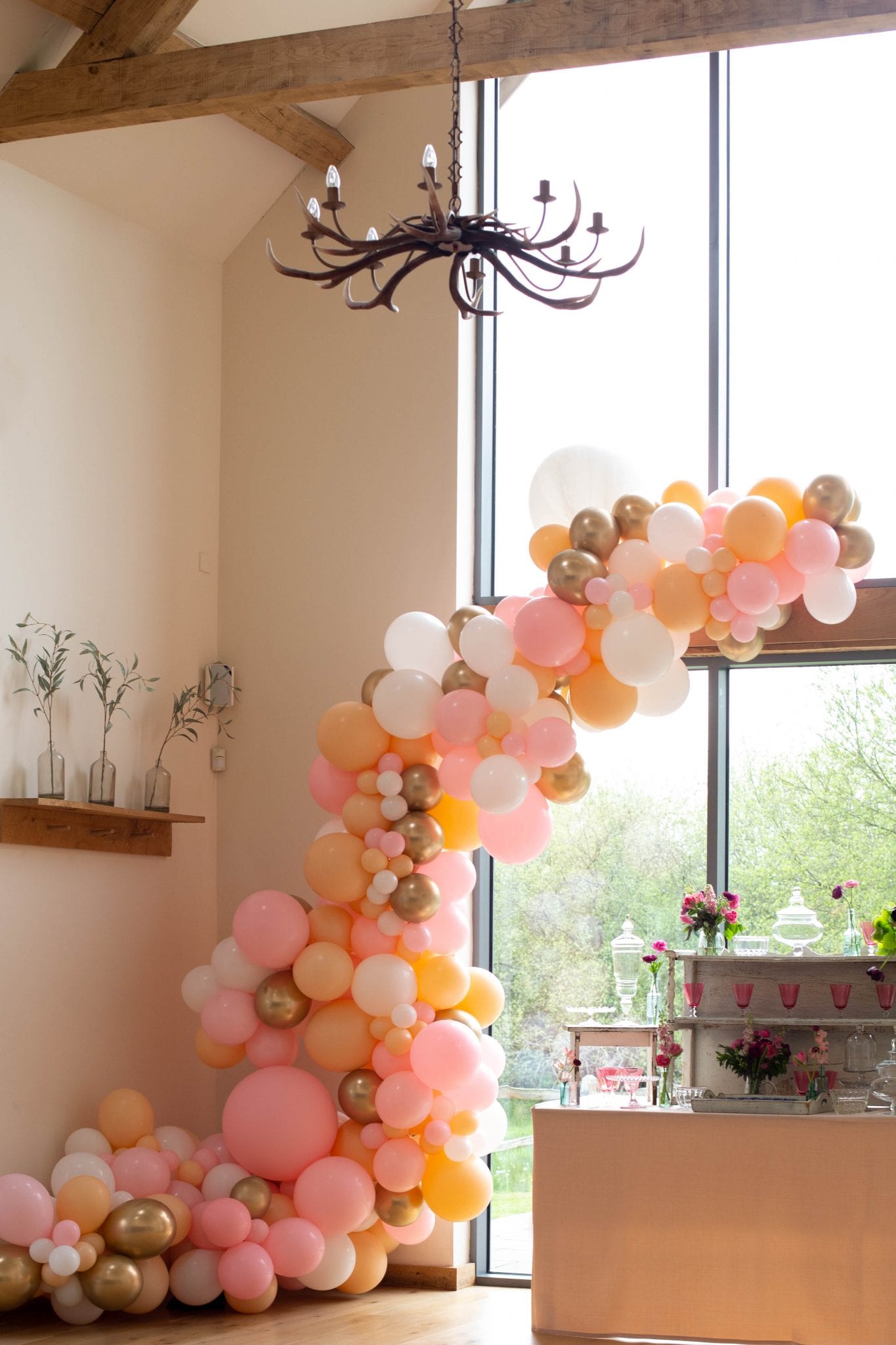 white coral peach pink wedding day balloon arch
