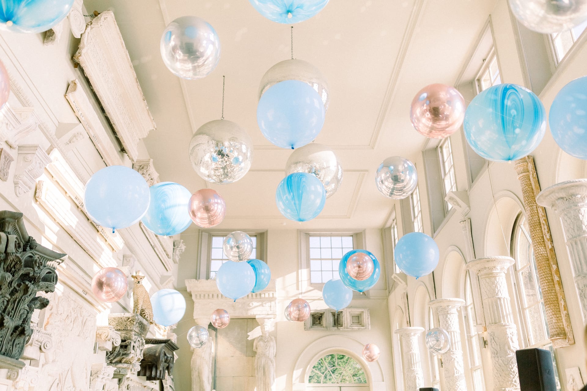Bubblegum balloons floating from the ceiling pale blue