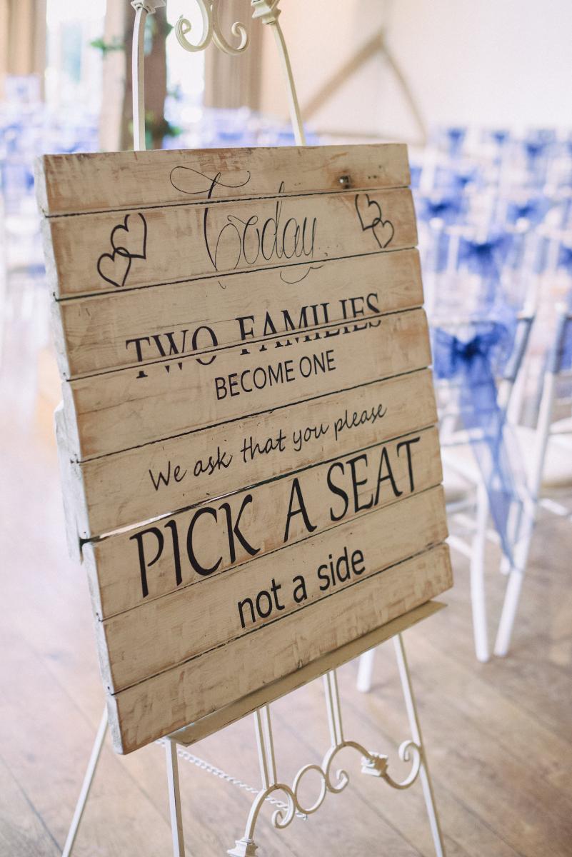 Cain Manor pick a seat sign