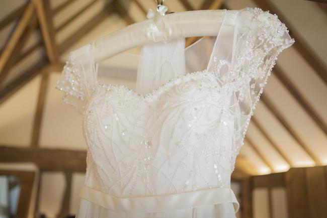 lace and beaded sleeved wedding dress