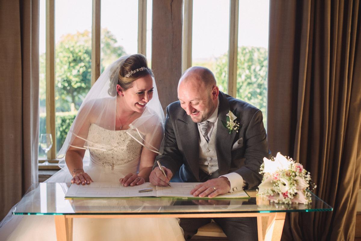 Cain Manor couple signing the register