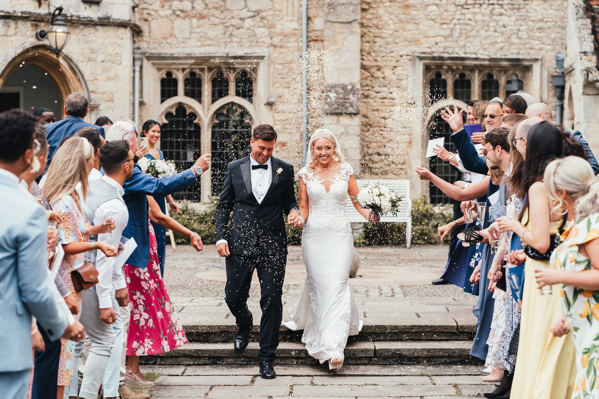 Notley Abbey wedding newlywed couple confetti walkway