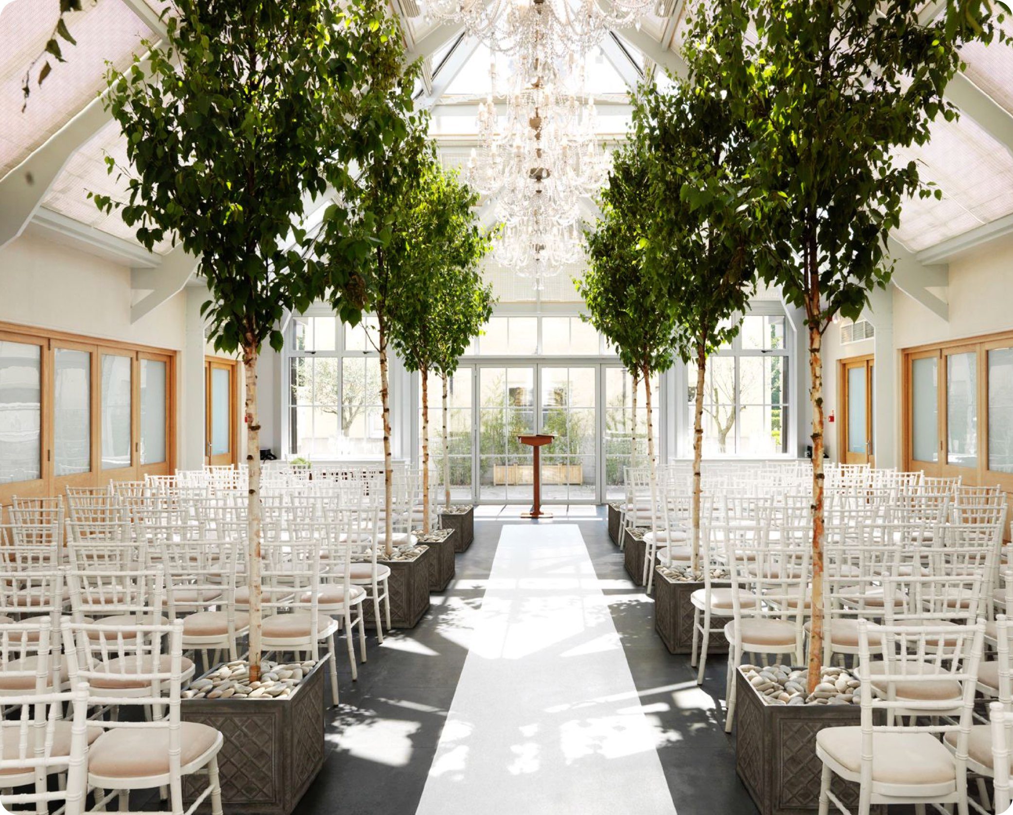 Ceremony in the atrium at Botleys Mansion wedding venue