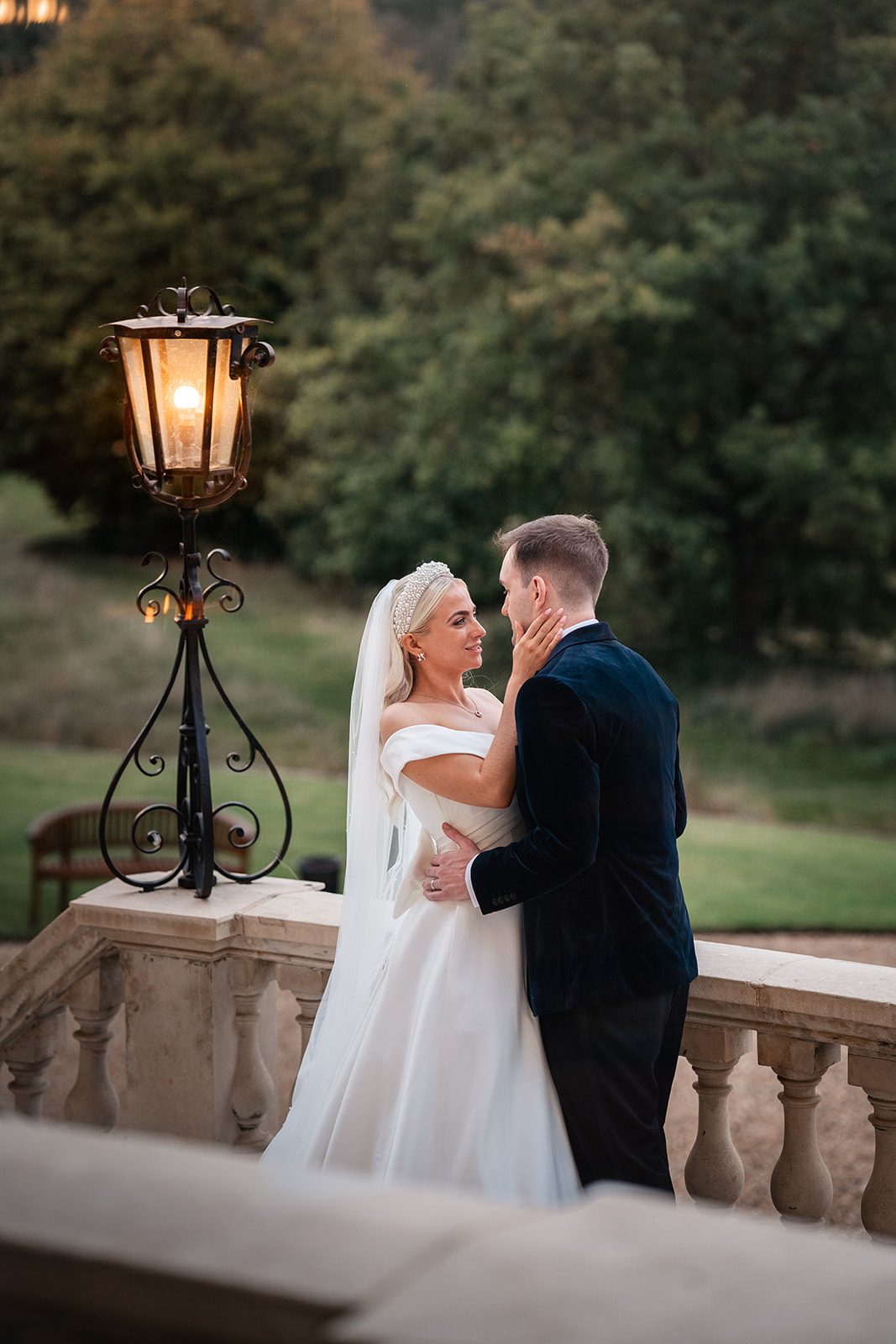 Newlyweds on the stone staircase at Botleys Mansion