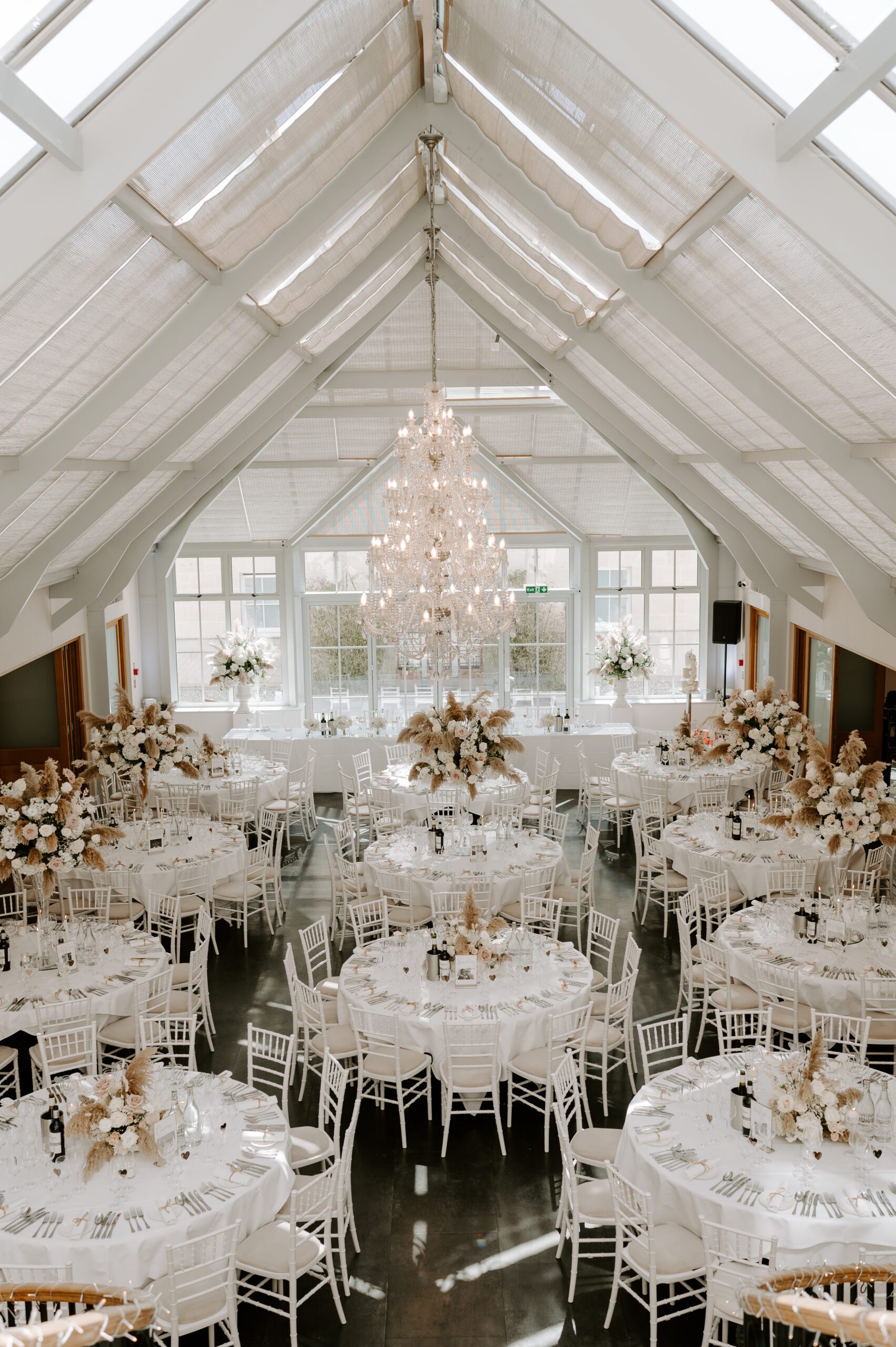 Wedding breakfast set up in the Atrium at Botleys Mansion