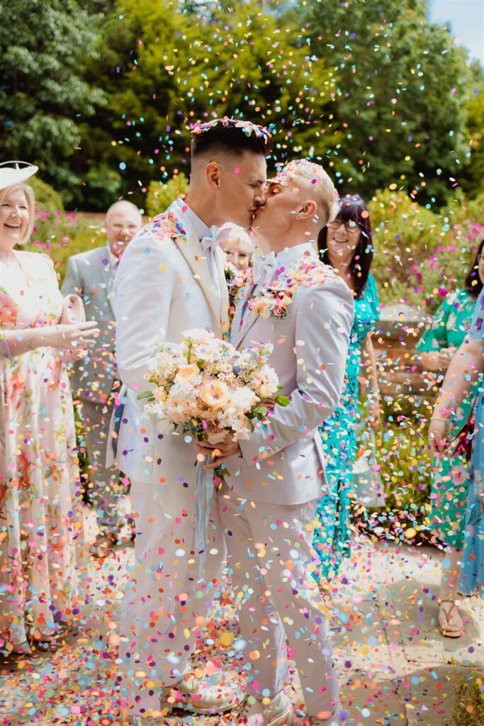 Summer gay wedding confetti shot at Cain Manor