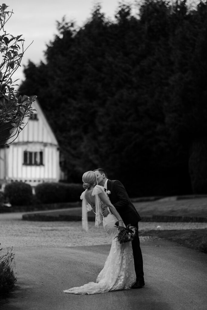 Bride and groom kissing at Cain Manor near Surrey